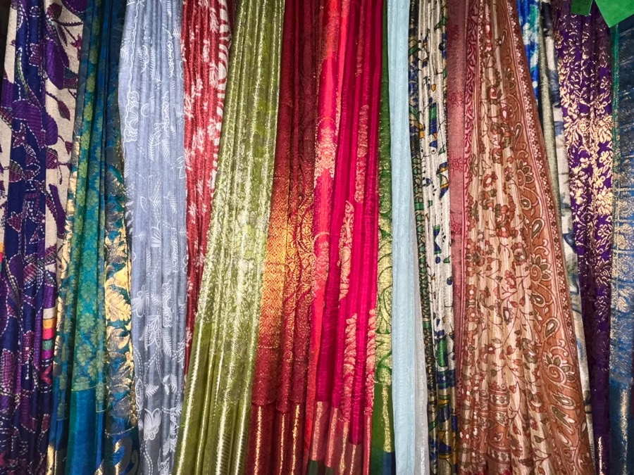 Colourful silk sarees hanging at Coronet Cleaners